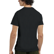 Flat-lay of piano graphic T‑shirt alongside a keyboard and music 
sheets